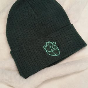 green knit hat with heartworks logo