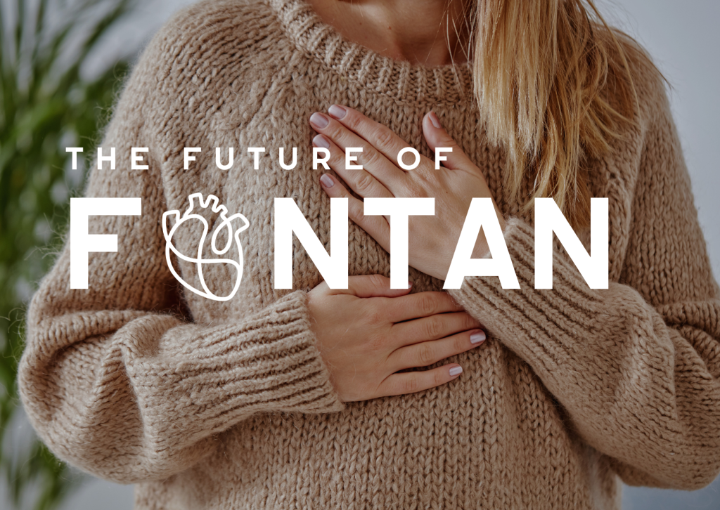 woman with hands placed over her heart