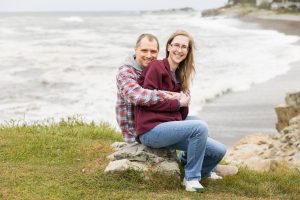 A couple posing near water