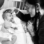 Baby in hospital bed with mother